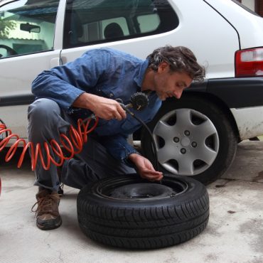 inspecting the tire pressure