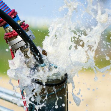 Cleaning newly constructed water bore or well with air compressor