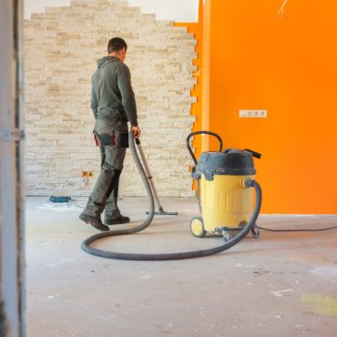 Construction worker Vacuuming Dust