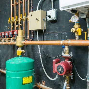 Copper pipes and valves with control unit mounted on the wall